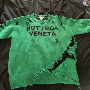Destroyed designer sweater.